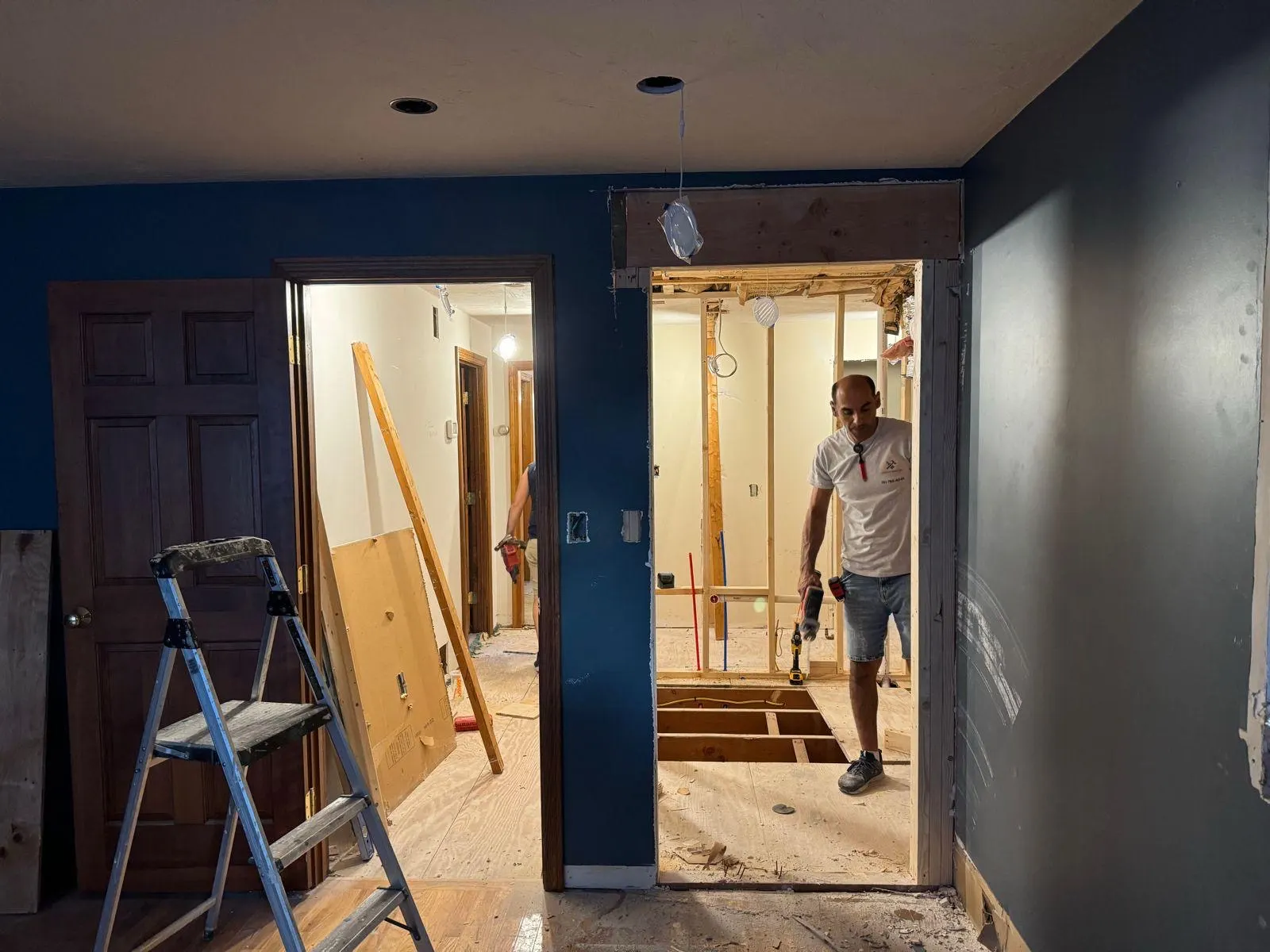 Prime Open crew opening a wall during a renovation